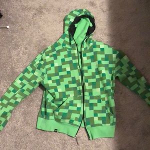 Green Minecraft creeper jacket.